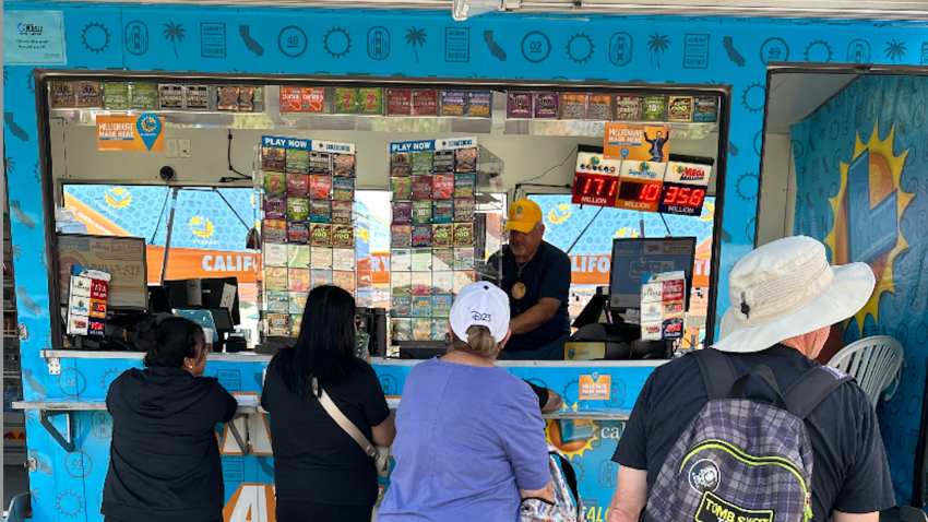 Visitors line up at the CA Lottery LIVE! booth at the OC Fair on August 1, 2024.